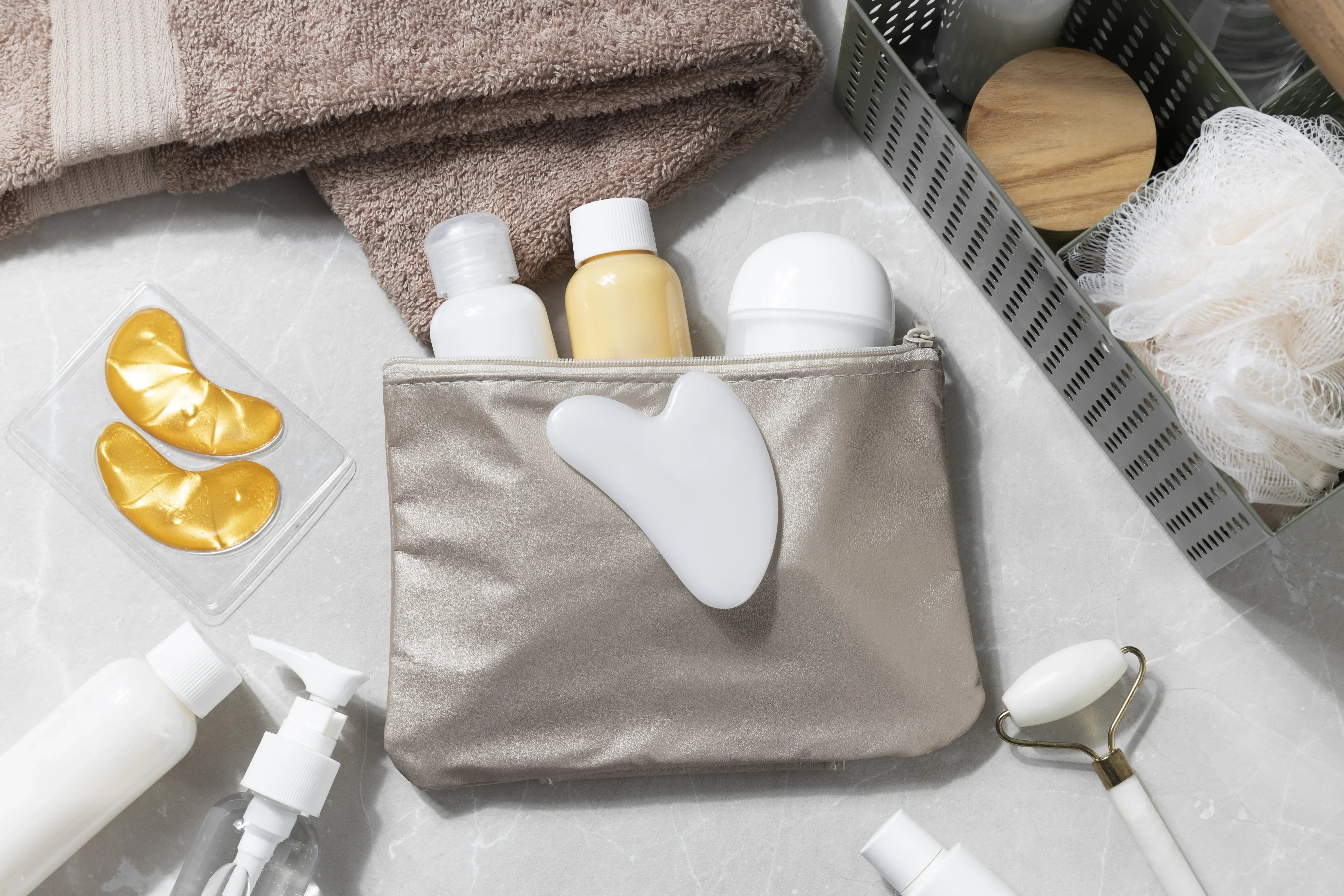 toilet-bag-with-products-arrangement-top-view
